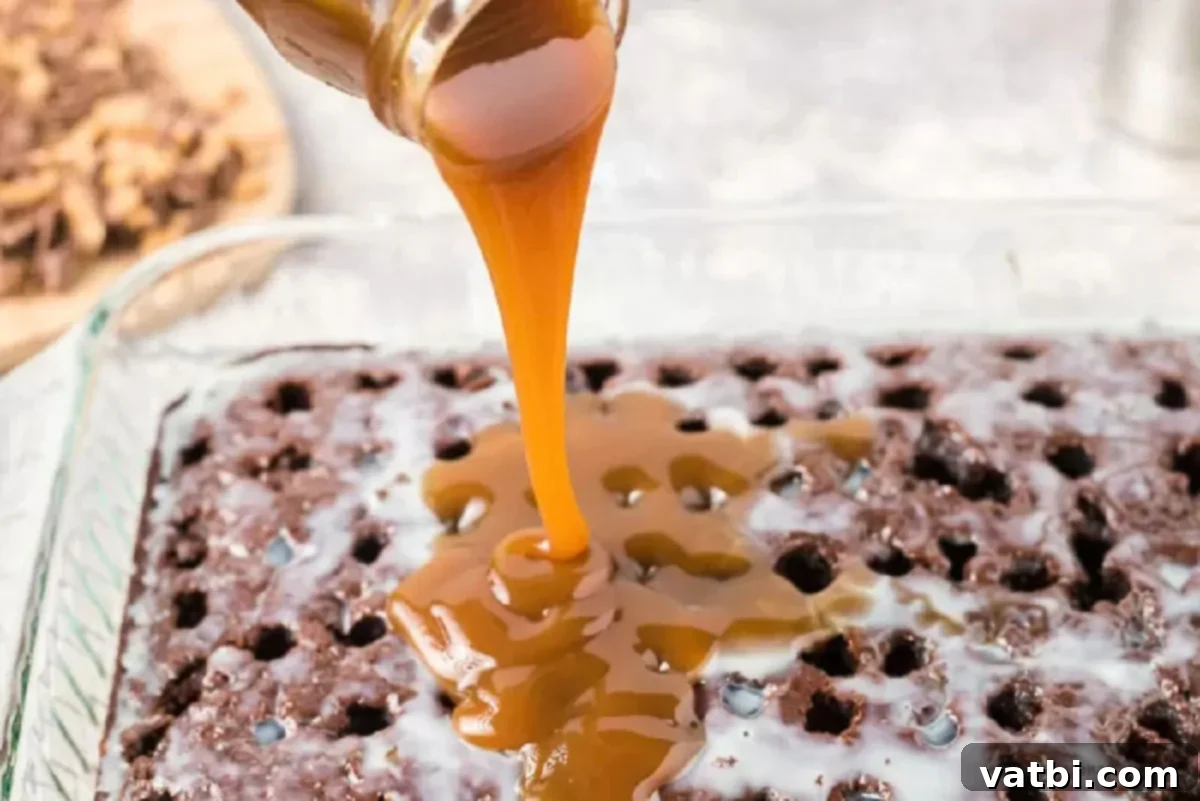 Decadent Dream Cake 3 Caramel Sauce poured over cake.