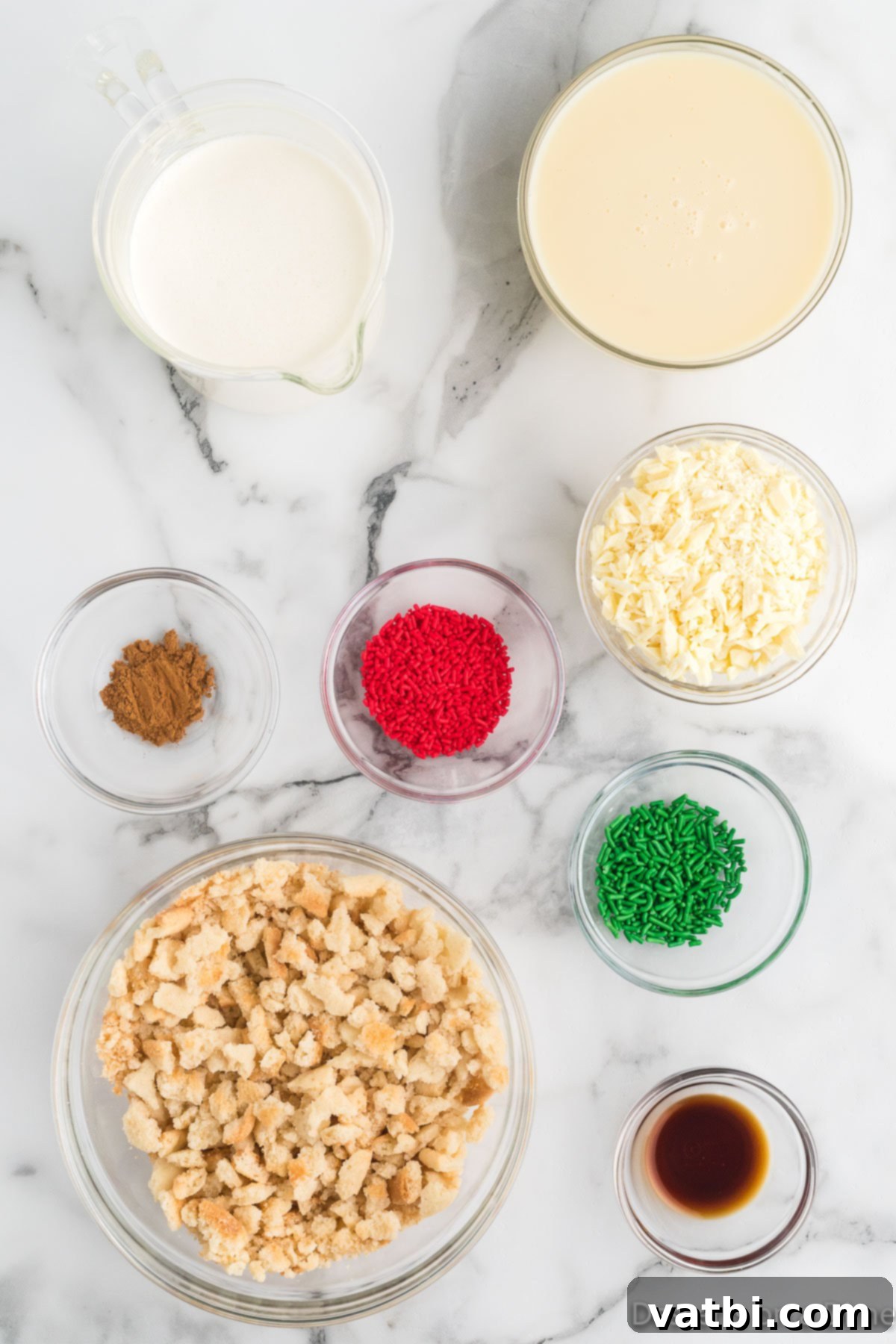 Festive Frozen Delights 3 A flat lay of all ingredients needed for Christmas Ice Cream: heavy whipping cream, sweetened condensed milk, vanilla extract, ground cinnamon, sugar cookies, white chocolate chunks, and festive red and green sprinkles.