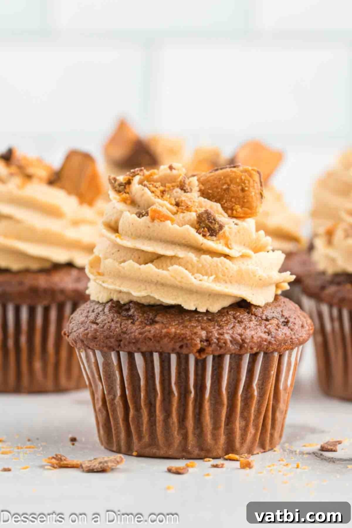 Butterfinger Cupcakes 12 Close-up of a Butterfinger cupcake with a perfect swirl of peanut butter frosting and crushed Butterfinger candy.
