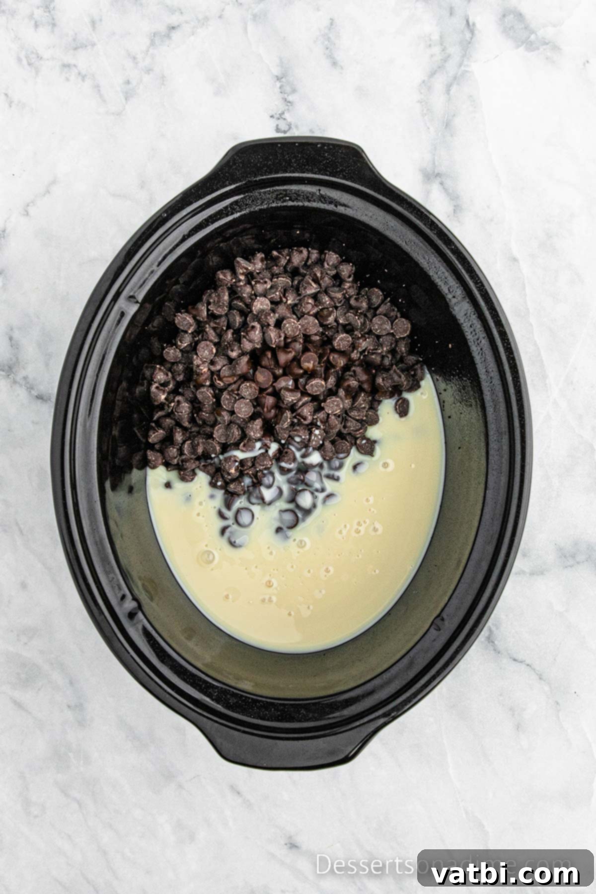 Crockpot with ingredients combined and ready to cook.