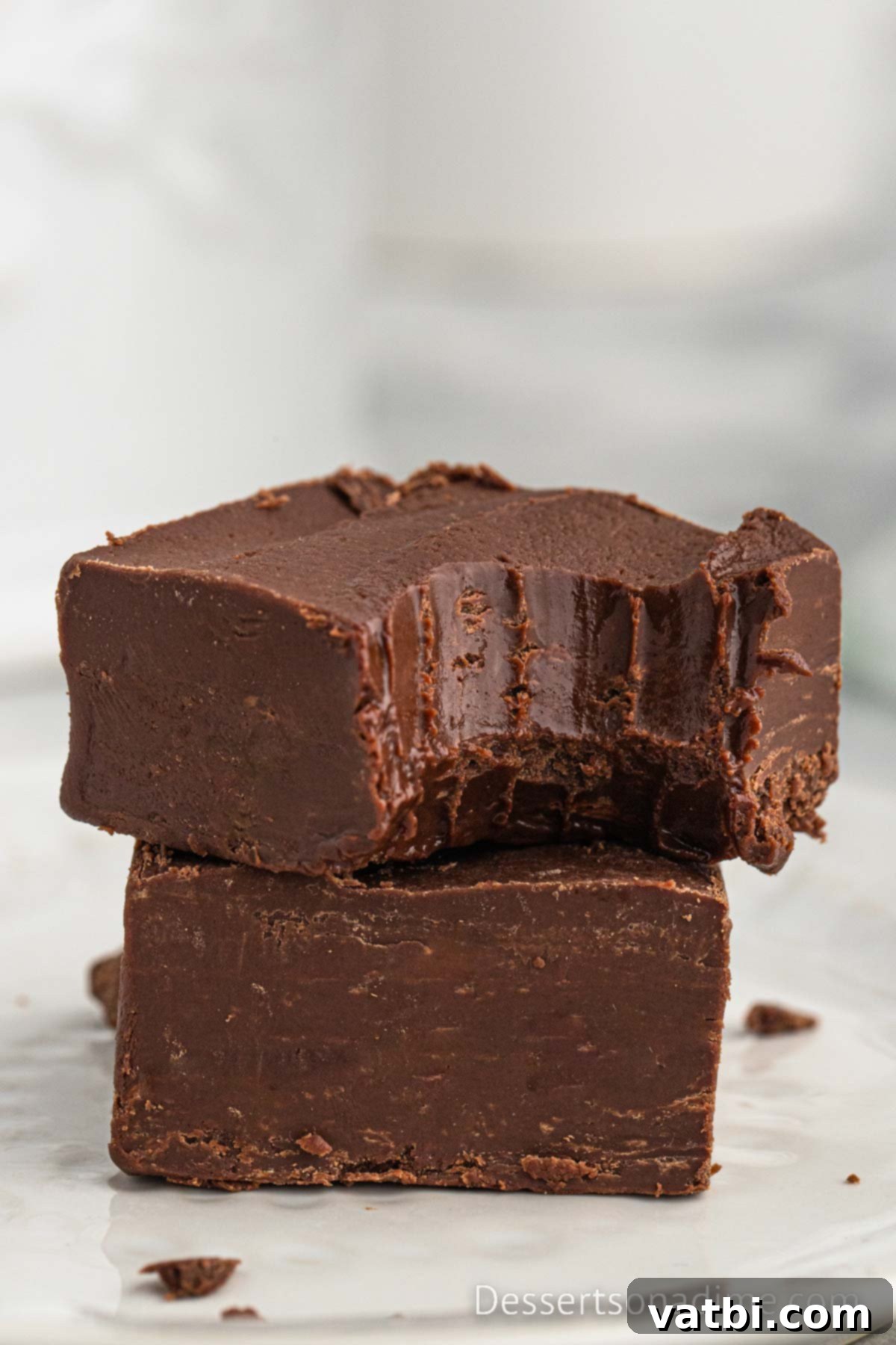 Crock Pot Fudge cut into squares, neatly arranged for serving.