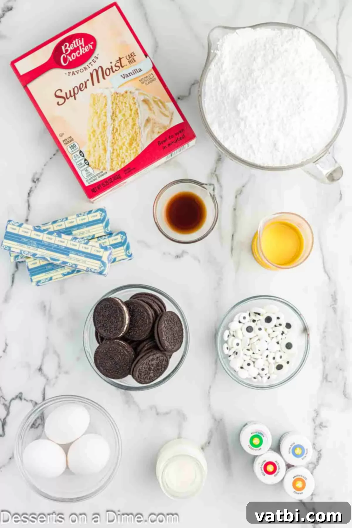 Ingredients for Monster Cupcakes - vanilla cake mix, butter, powdered sugar, heavy cream, gel food coloring, candy eyeballs, oreo cookies.