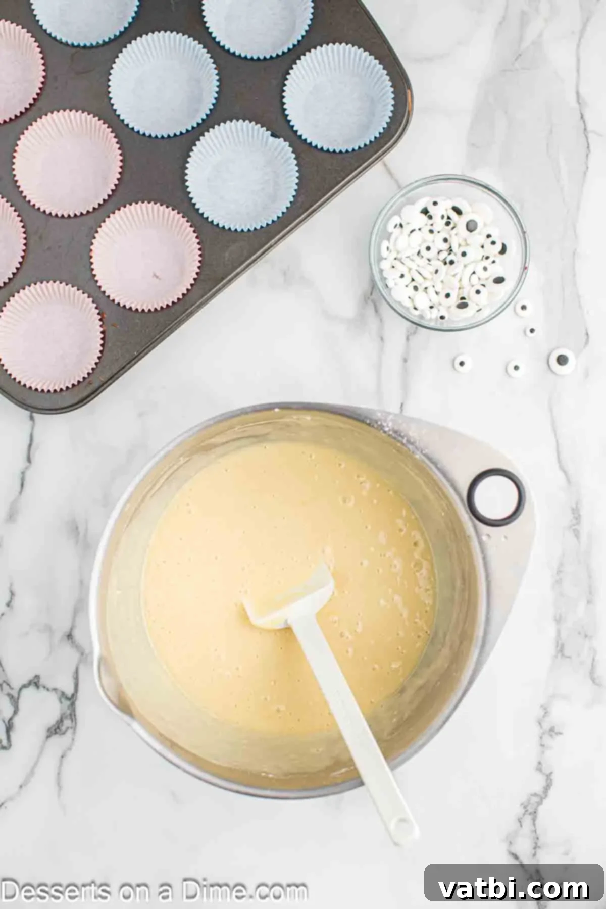 Mixing bowl with cake batter combined together.