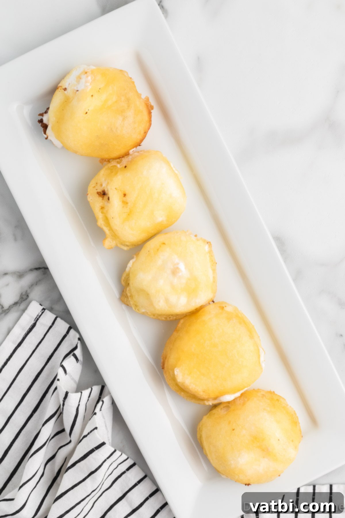 Fried marshmallows on serving tray. 