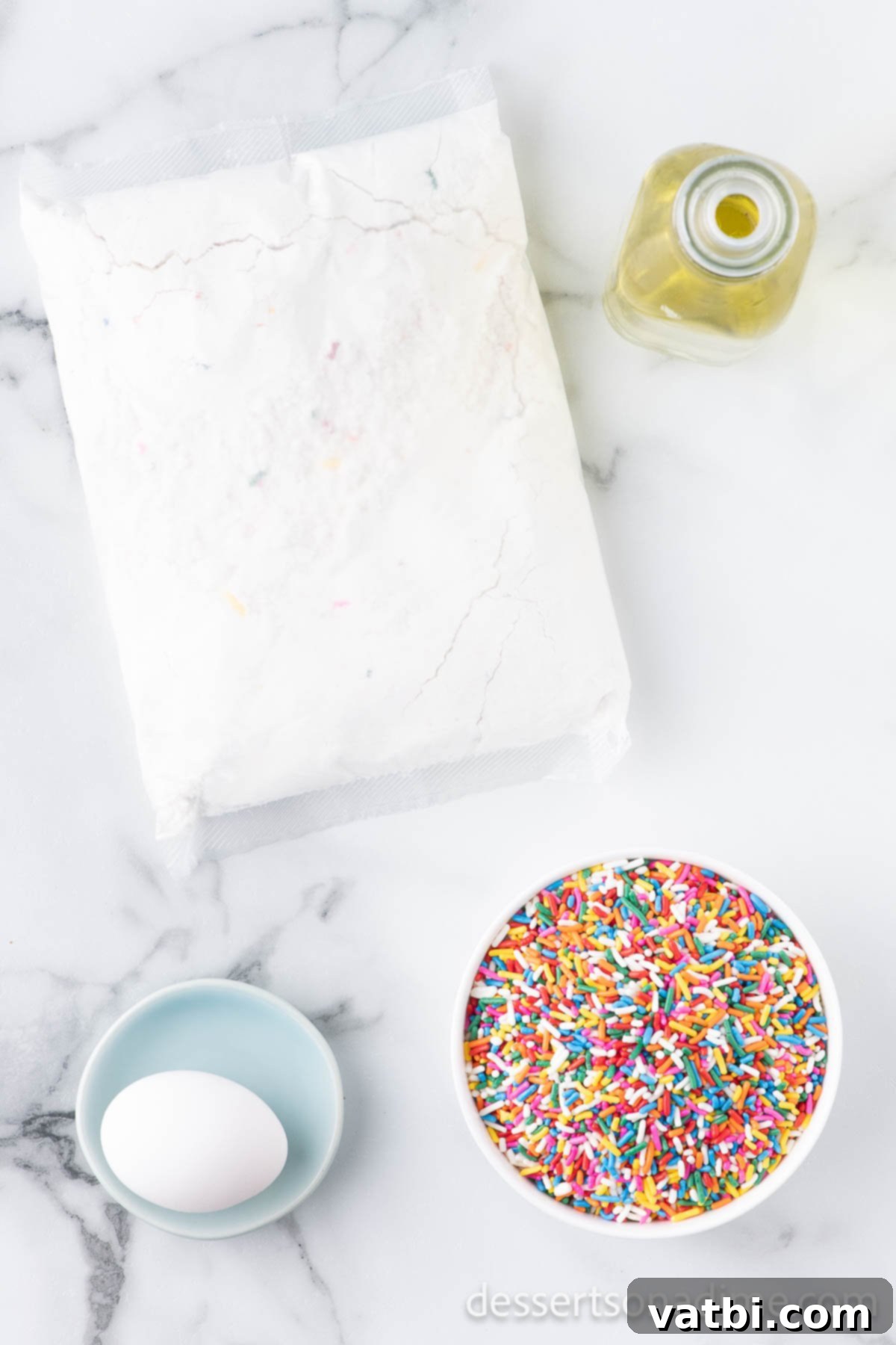 Funfetti Cake Mix Cookies take minutes to make and you only need 3 ingredients. These cookies are fun to make and are perfectly chewy. These easy cookies are one of my favorite recipes. Learn how to make Funfetti cake mix cookies here! #dessertsonadime #cakemixcookies #funfetti Ingredients for cookies - cake mix, egg, oil. sprinkles.
