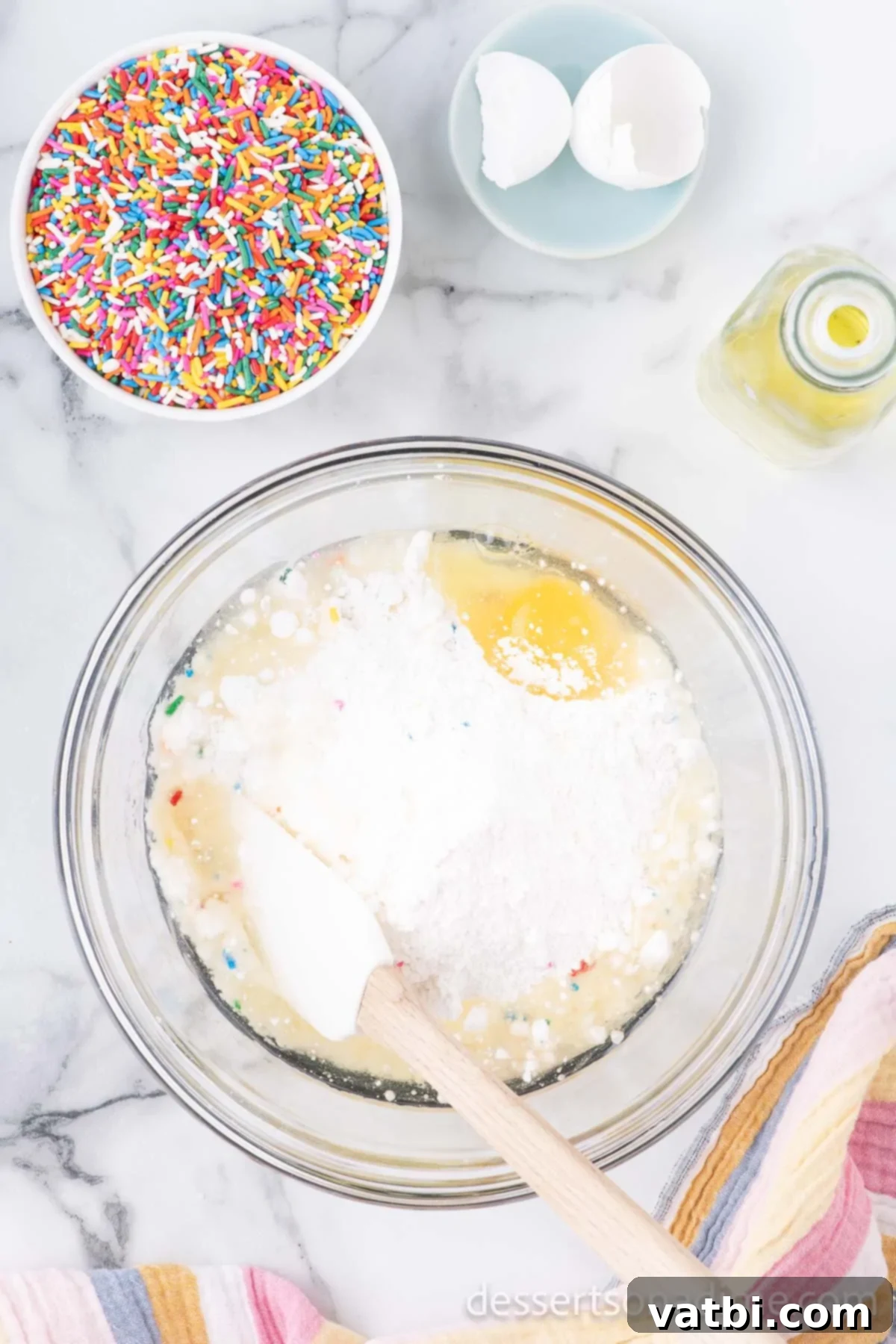 Easy Funfetti Cake Mix Cookies 2 Mixing bowl with cake mix, eggs, oil.