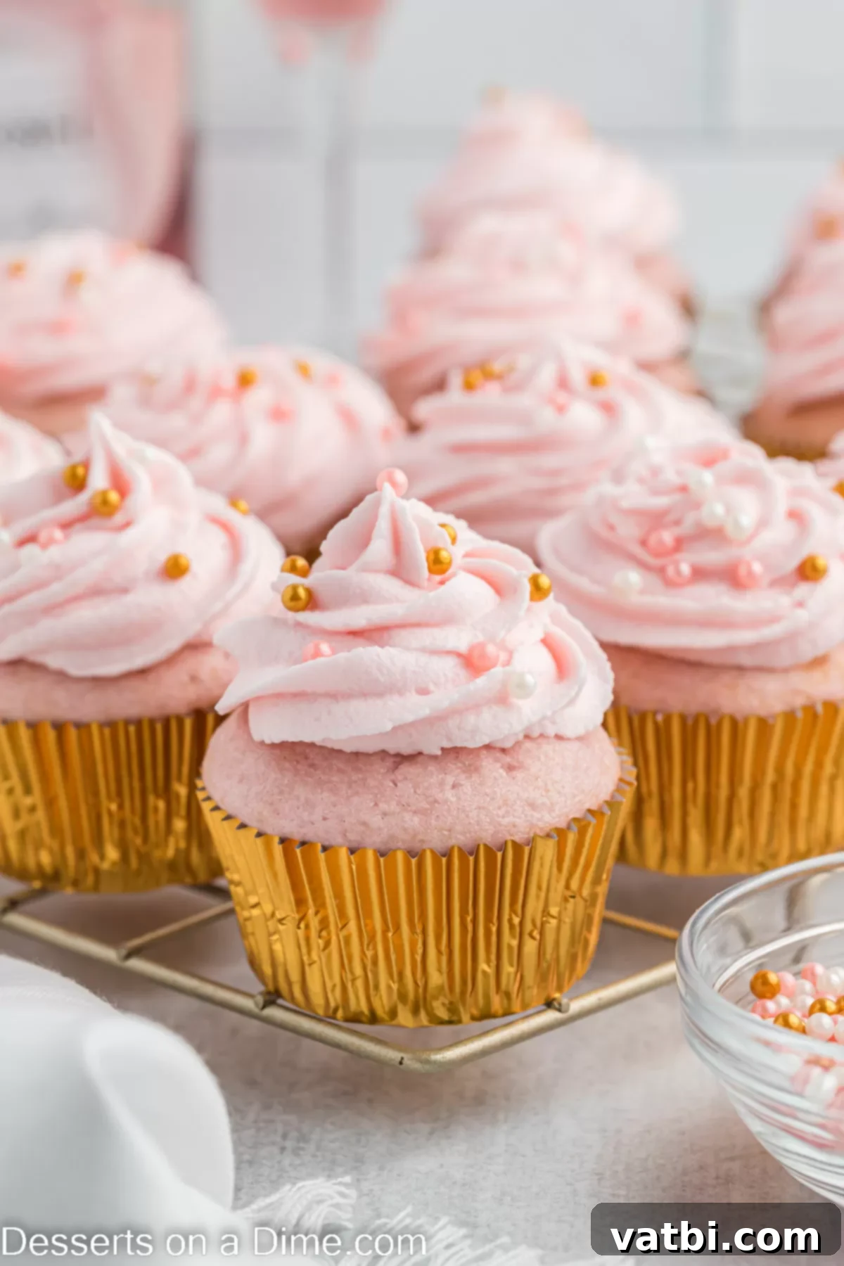 How to Freeze Cupcakes Perfectly 2 Cupcakes on cooling rack.