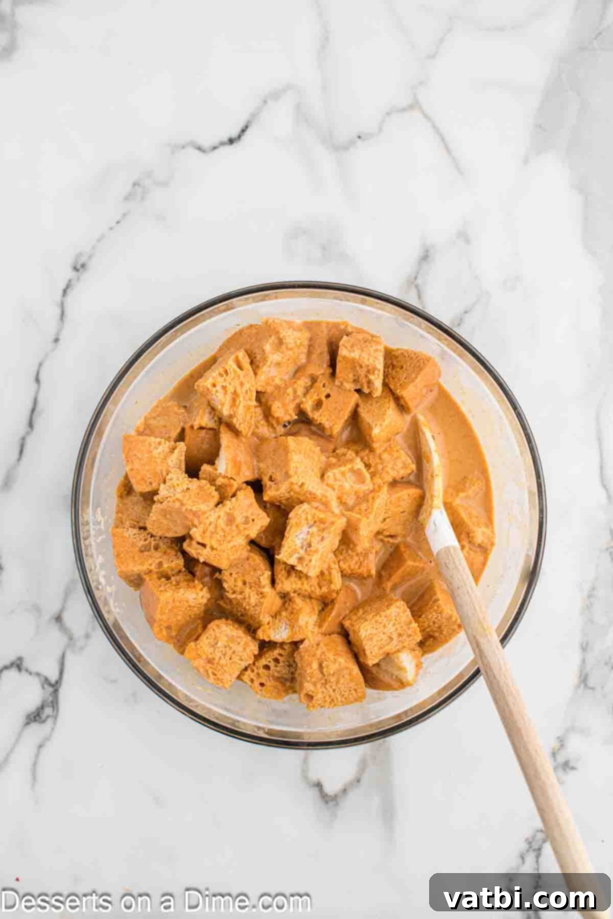 Decadent Pumpkin Bread Pudding 8 Pumpkin custard mixture poured over bread cubes.