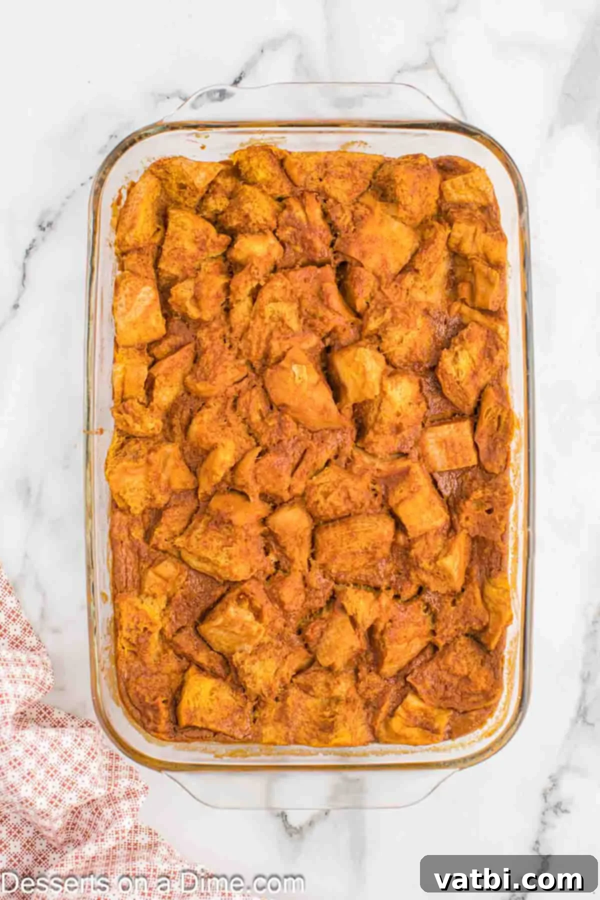Decadent Pumpkin Bread Pudding 10 Baked pumpkin bread pudding, golden brown and ready to serve.
