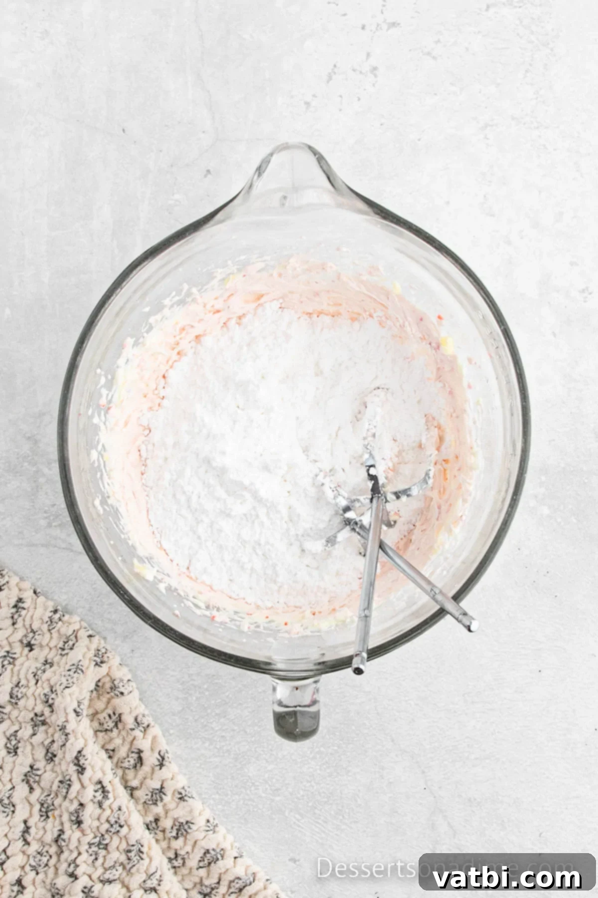 Powdered sugar added to bowl and combined. 