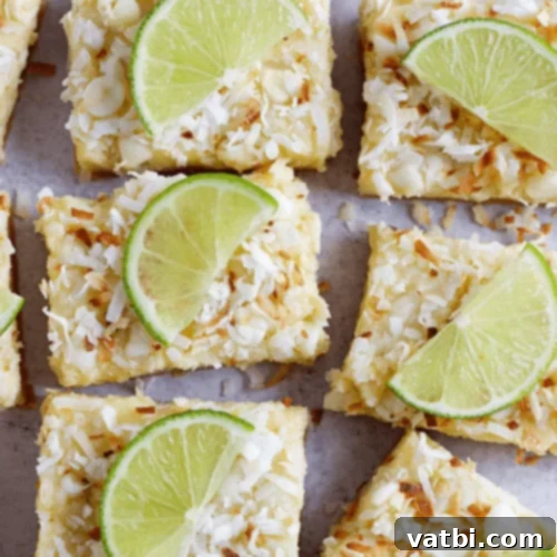67 Zesty Lime Desserts 18 White Chocolate Coconut Lime Bars with a buttery crust, creamy lime filling, white chocolate chips, and coconut.