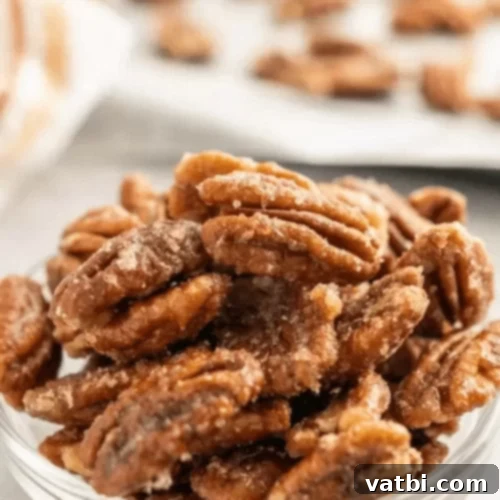 45 Festive Gluten-Free Christmas Delights 11 A bowl of glossy Candied Pecans, a sweet and crunchy gluten-free snack.