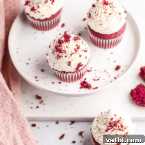 45 Festive Gluten-Free Christmas Delights 25 Vibrant Gluten-Free Red Velvet Cupcakes with cream cheese frosting, a festive holiday dessert.