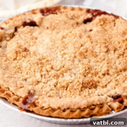 Thanksgiving Dessert Perfection: 35 Gluten-Free Pies 14 A rustic gluten-free Apple Pear Pie, golden brown and ready to be served, promising warm, spiced fruit flavors.