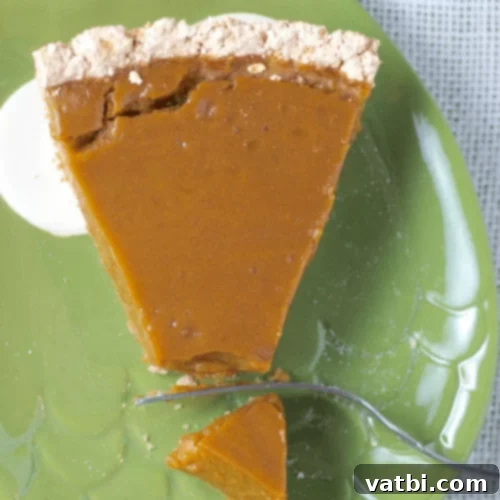 Thanksgiving Dessert Perfection: 35 Gluten-Free Pies 15 A slice of Gluten-Free Pumpkin Banana Pie, revealing its creamy texture and rich color, prepared and ready to be enjoyed.