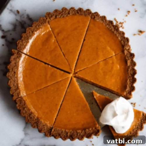 Thanksgiving Dessert Perfection: 35 Gluten-Free Pies 16 A tempting slice of Gingersnap Pumpkin Pie, perfectly spiced and ready to serve.