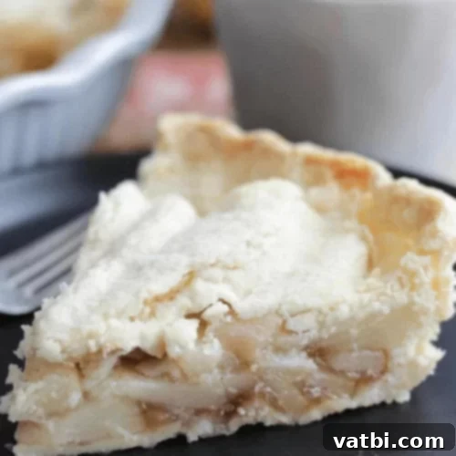 Thanksgiving Dessert Perfection: 35 Gluten-Free Pies 31 A slice of elegant Pear Pie, featuring fresh pears and a golden crust, presented on a plate.