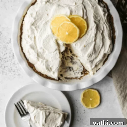 Thanksgiving Dessert Perfection: 35 Gluten-Free Pies 33 A refreshing No Bake Lemon Icebox Pie, with its vibrant lemon filling, being sliced and ready to serve.