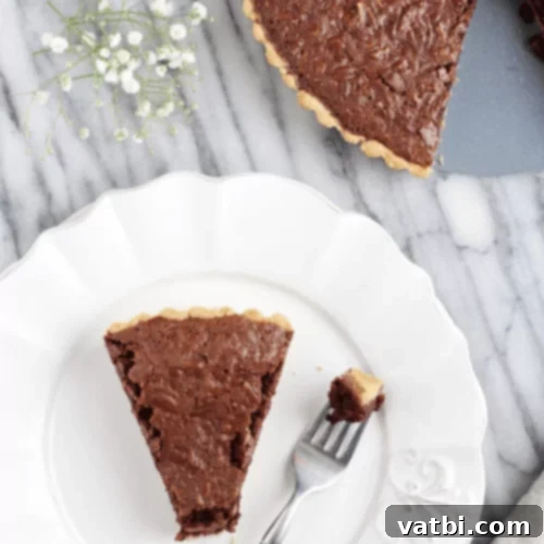Thanksgiving Dessert Perfection: 35 Gluten-Free Pies 6 A decadent slice of bourbon pie, enriched with chocolate and pecans, ready for a special occasion.