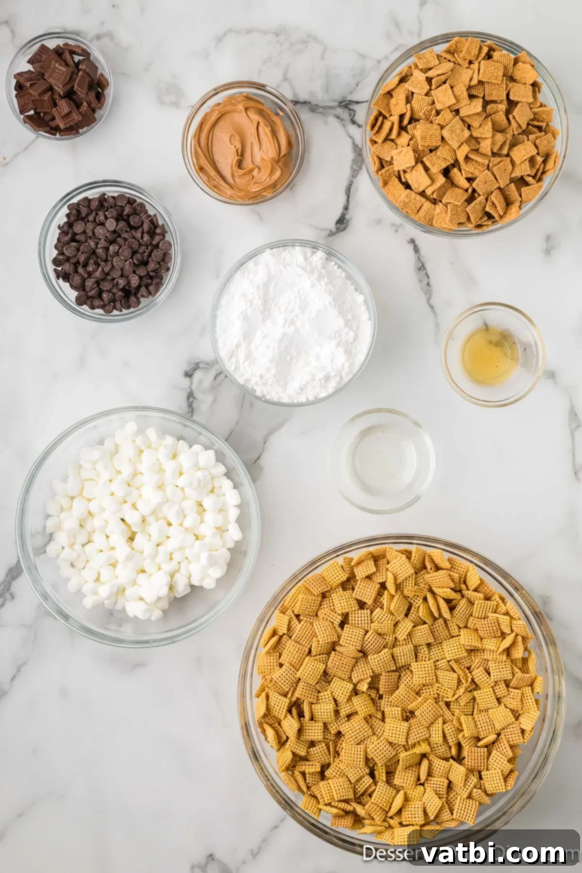 S'mores Campfire Crunch 3 Ingredients for S'mores Puppy Chow laid out: Chex Cereal, creamy peanut butter, chocolate chips, vanilla extract, mini marshmallows, Golden Grahams cereal, and Hershey chocolate bars.