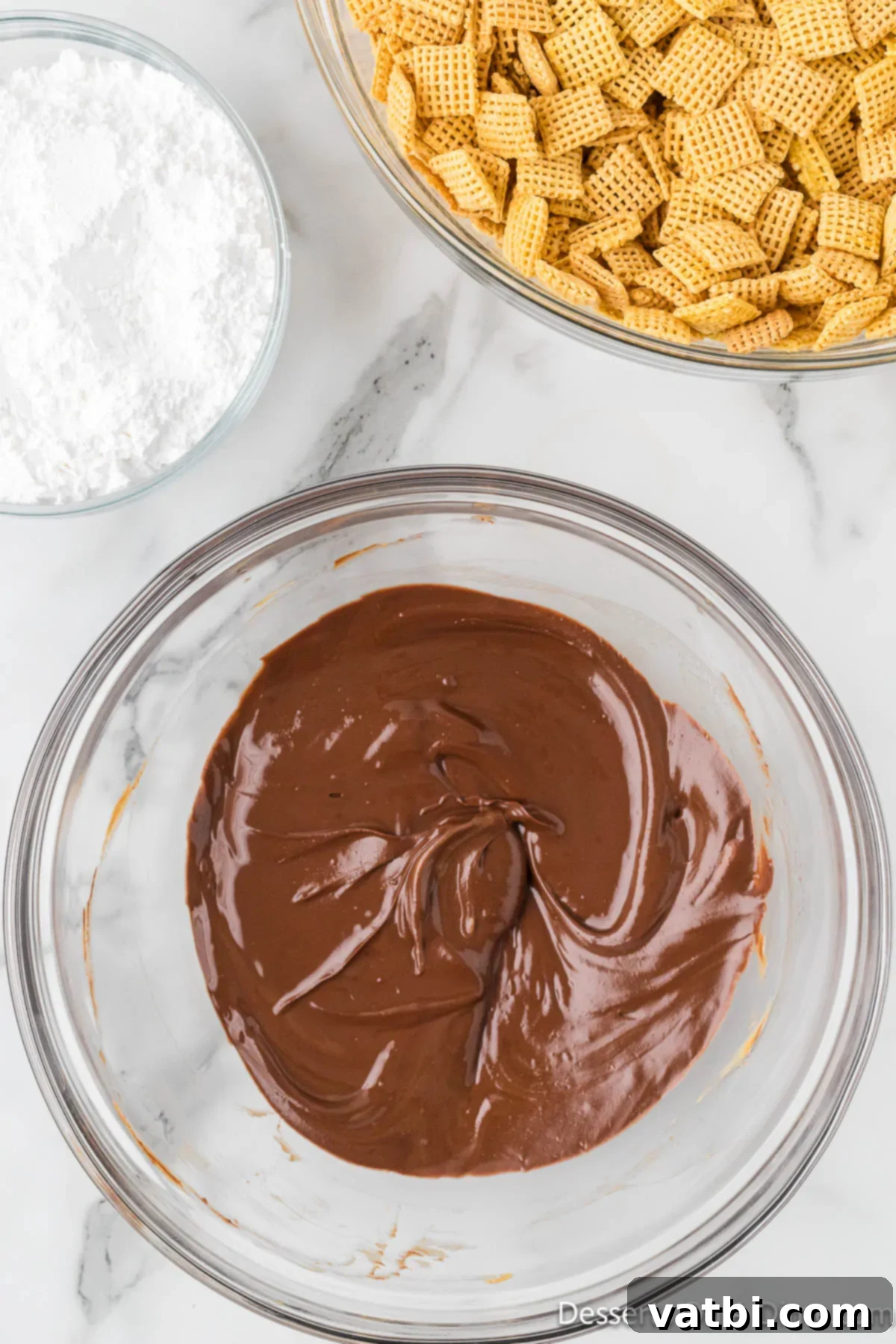 S'mores Campfire Crunch 5 Melted chocolate and peanut butter mixture in a bowl, smooth and glossy.