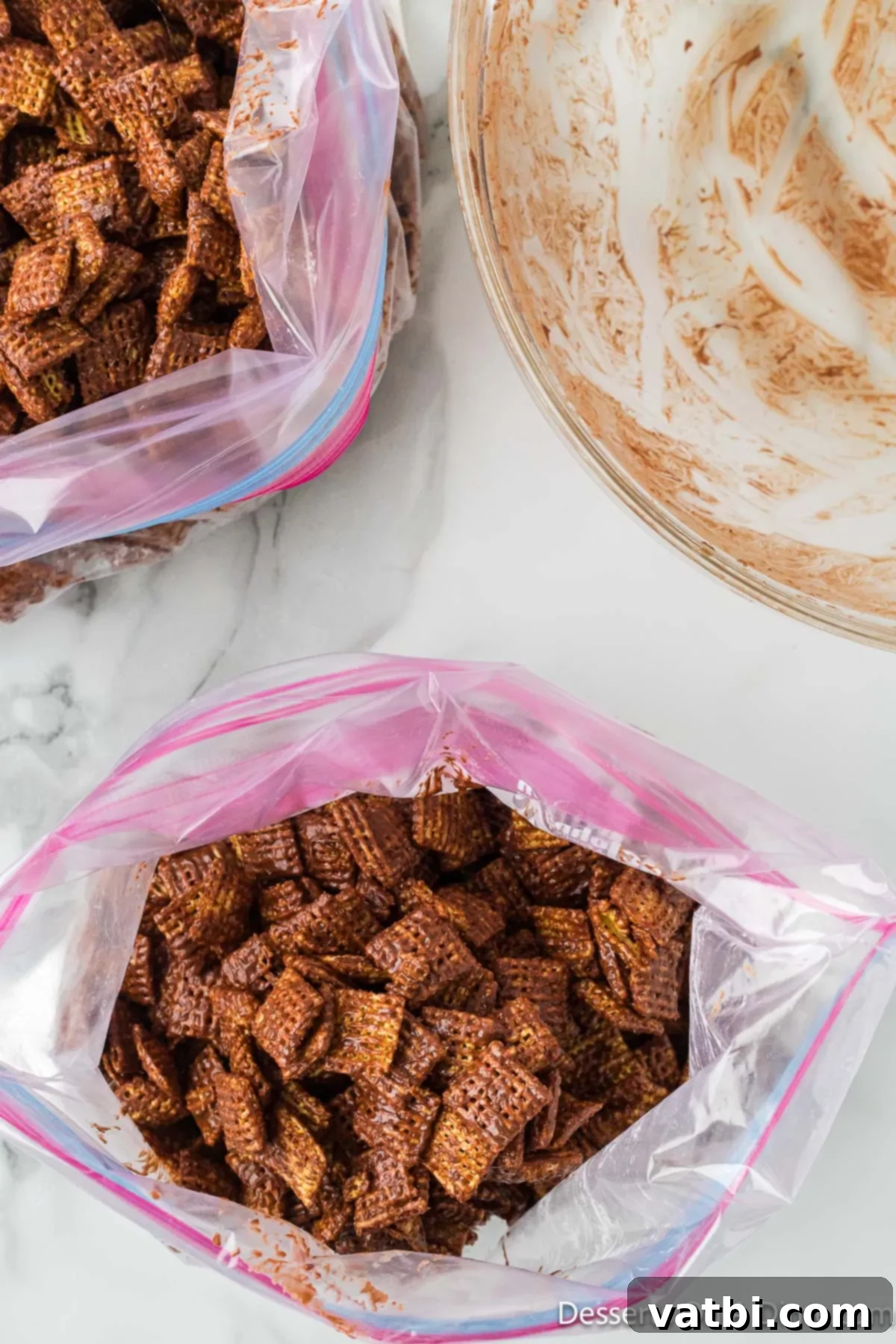 S'mores Campfire Crunch 8 Coated cereal mixed with powdered sugar in a ziplock bag, ready for shaking.