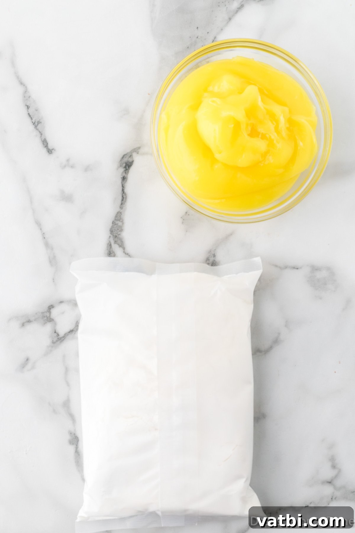 Ingredients for 2 ingredient lemon bars: a box of angel food cake mix and a can of lemon pie filling.