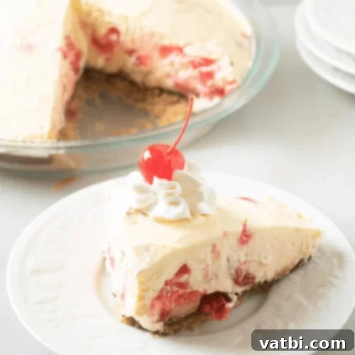 Bake-Free Bliss: 69 Easy Pie Recipes 10 A slice of No Bake Cherry Almond Mousse Pie with a cherry on top.