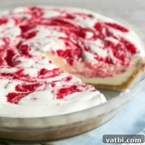 Bake-Free Bliss: 69 Easy Pie Recipes 16 A slice of No Bake Strawberry Lemonade Pie with a strawberry and lemon garnish.
