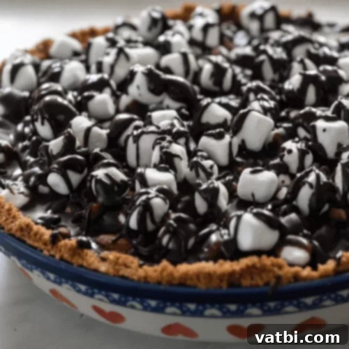Bake-Free Bliss: 69 Easy Pie Recipes 31 A slice of No Bake Rocky Road Pie with marshmallows and chocolate chips.