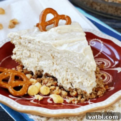 Bake-Free Bliss: 69 Easy Pie Recipes 34 A slice of No Bake Peanut Butter Pretzel Pie with chopped pretzels and peanut butter drizzle.