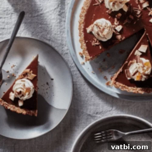 Bake-Free Bliss: 69 Easy Pie Recipes 56 A slice of No Bake Vegan Chai Chocolate Tart with berries and spices.