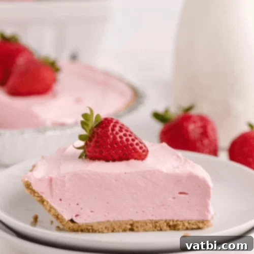 Bake-Free Bliss: 69 Easy Pie Recipes 60 A slice of No Bake Kool Aid Pie with a cherry on top.