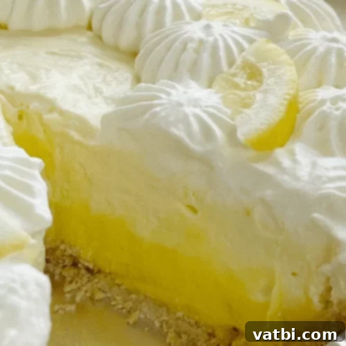 Bake-Free Bliss: 69 Easy Pie Recipes 61 A slice of No Bake Lemon Pudding Pie with a lemon slice.