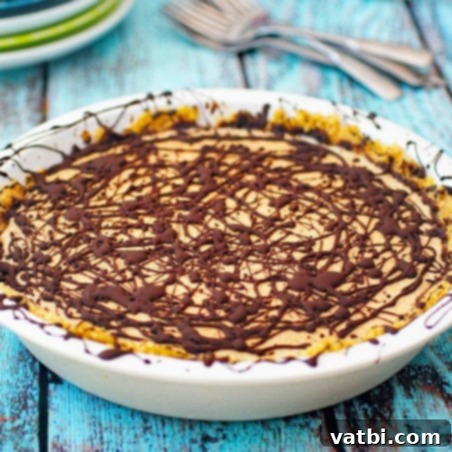 Bake-Free Bliss: 69 Easy Pie Recipes 62 A slice of No Bake Almond Butter Pie garnished with chopped almonds.