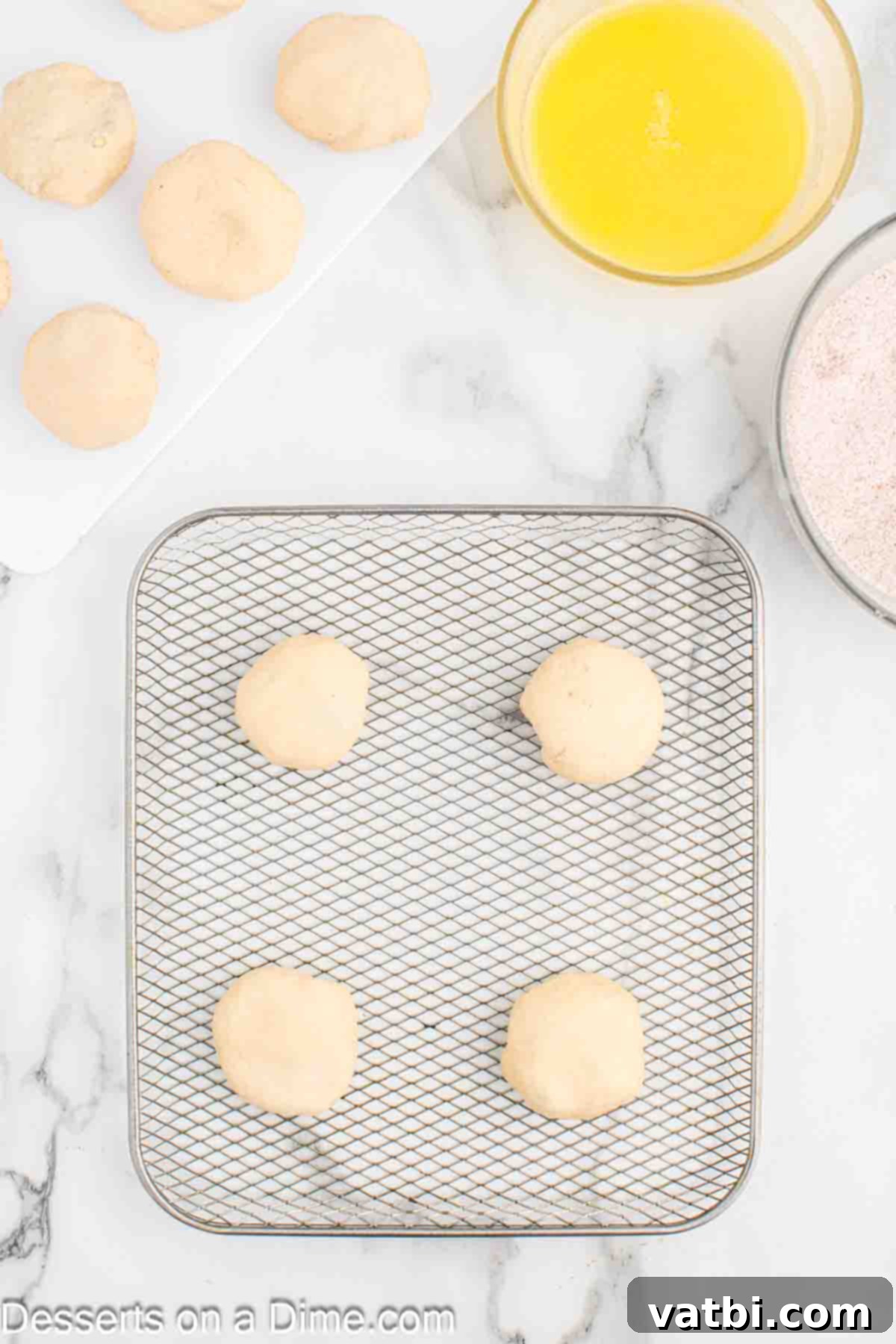 Air-Fried Apple Pie Puffs 9 Round biscuit dough balls, filled and sealed, ready for the air fryer.