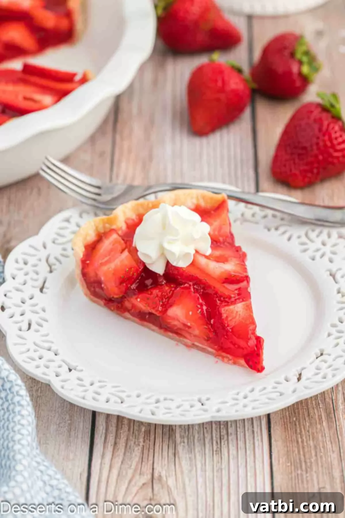 Perfect Strawberry Pie 2 Slice of strawberry pie topped with whipped cream.