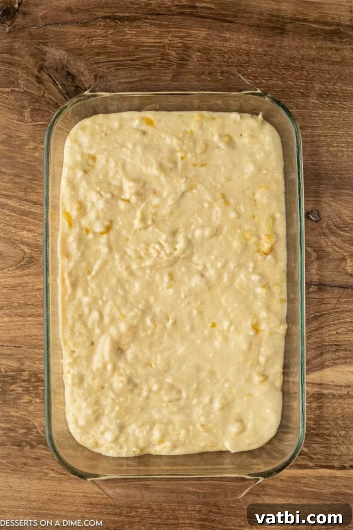 Fudgy Banana Bread Brownies 7 Smooth banana bread brownie batter being poured evenly into a prepared 9x13 inch baking dish.