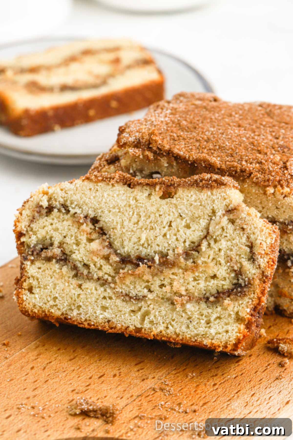 Cinnamon Sugar Snickerdoodle Bread 2 Slices of warm Snickerdoodle Bread ready to enjoy, showcasing the beautiful cinnamon sugar swirls.