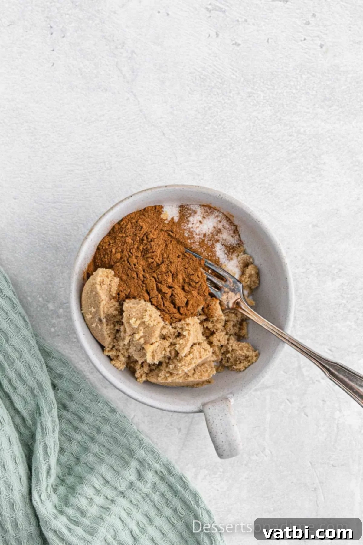Cinnamon Sugar Snickerdoodle Bread 7 Small bowl containing the cinnamon sugar swirl mixture, blended with a fork.