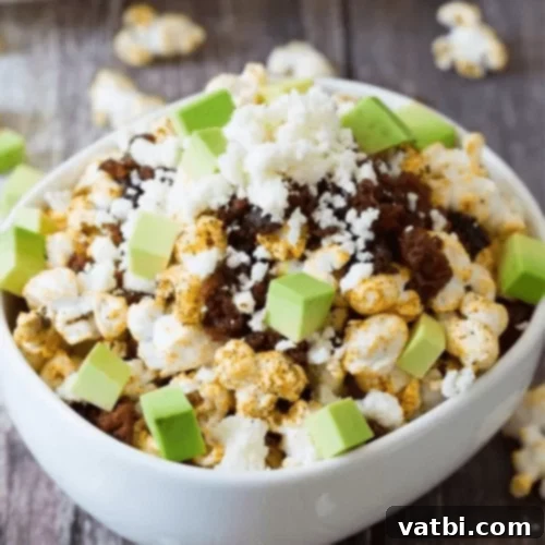 Gourmet Popcorn Creations 24 Tex Mex Popcorn with spices, sun-dried tomatoes, avocado, queso fresco, and chorizo.