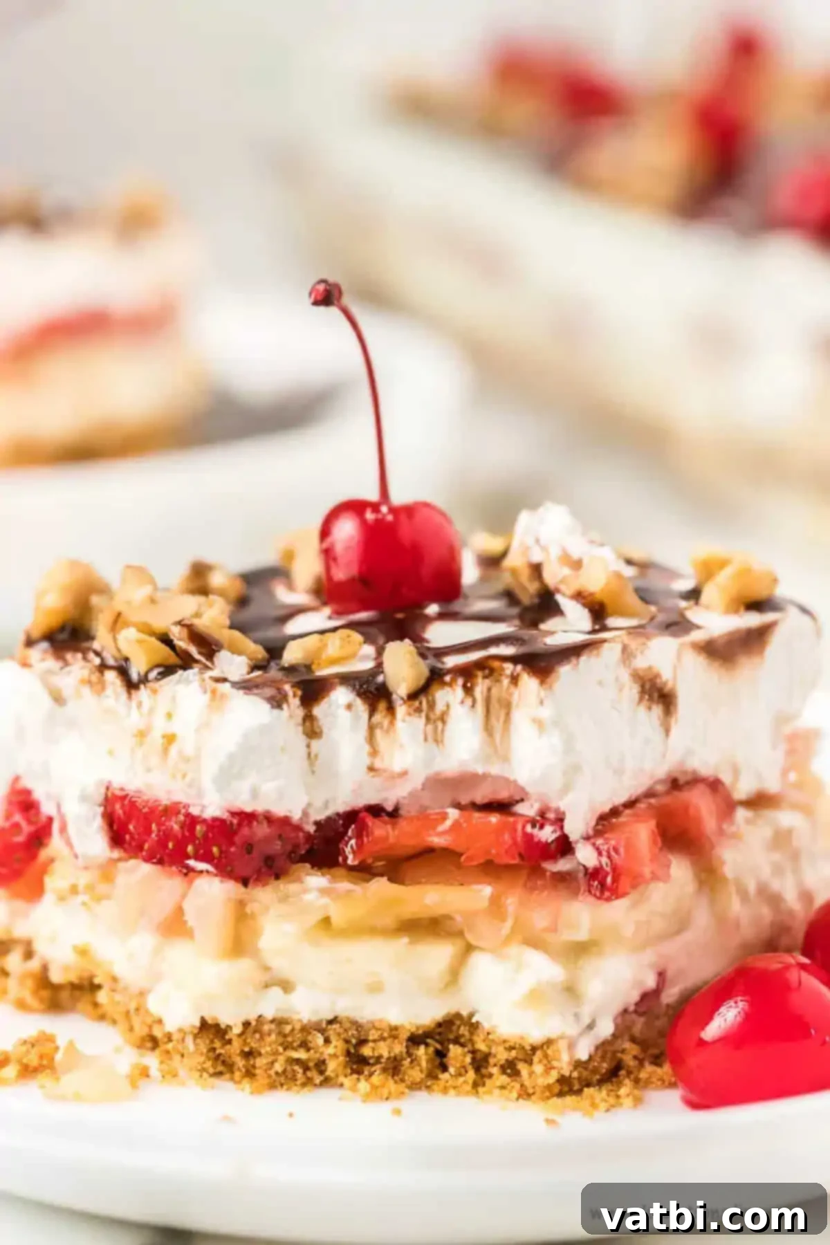 Slice of banana split cake on a plate