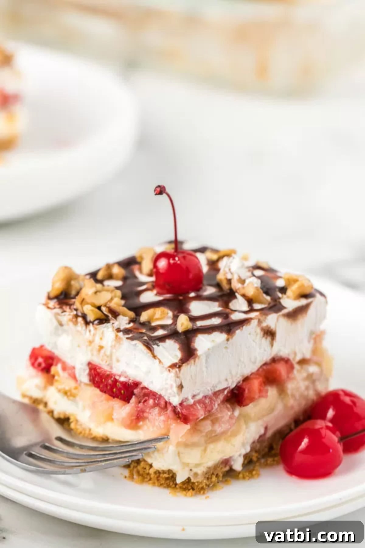 Slice of banana split cake on a plate