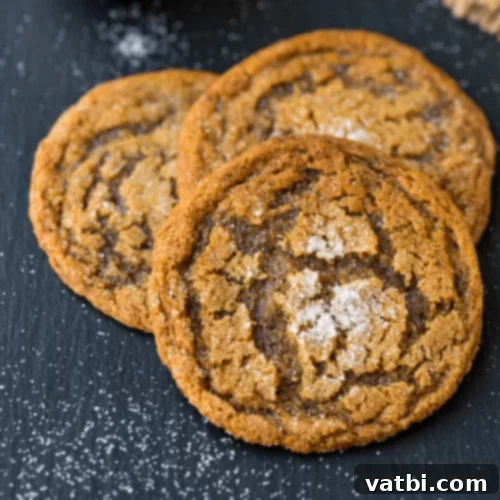 Warm Bacon Molasses Cookies on a cooling rack.