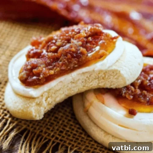Maple Bacon Cookies topped with frosting and bacon bits.