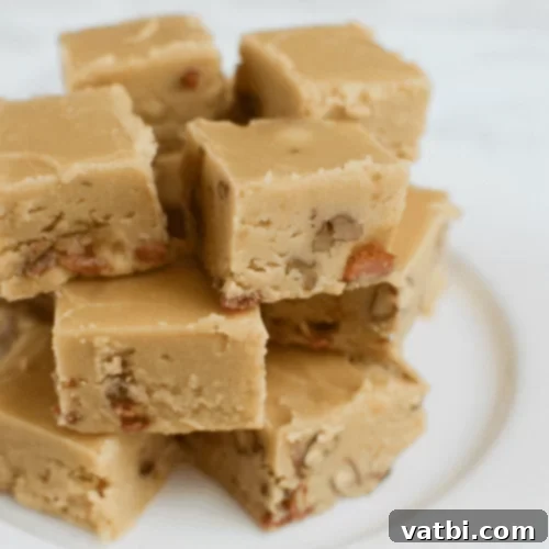 Squares of Maple Bacon Fudge with visible bacon bits.