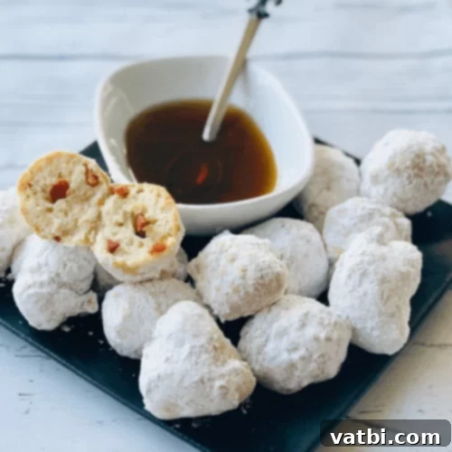 Fluffy Bacon Beignets dusted with powdered sugar.