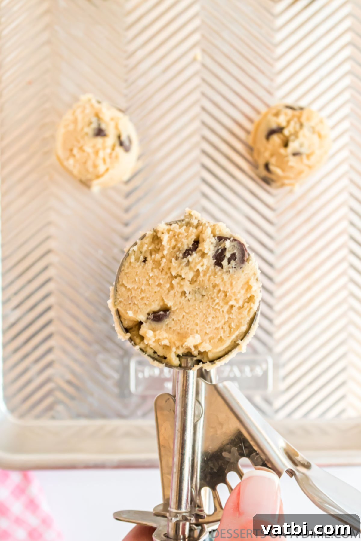 Decadent Cream Cheese Chocolate Chip Cookies 8 A perfect scoop of cream cheese chocolate chip cookie dough ready for baking.