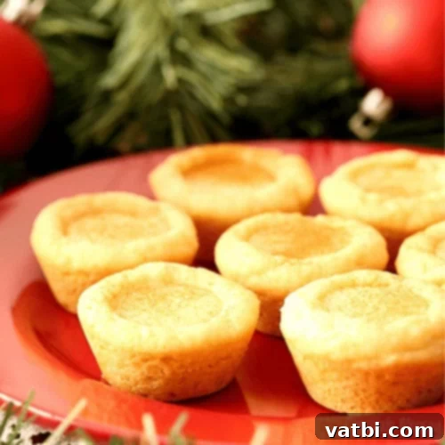 53 Holiday Eggnog Delights 32 Eggnog filled sugar cookie cups, a festive treat for sharing.