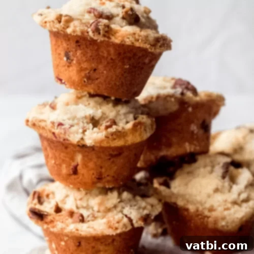 53 Holiday Eggnog Delights 34 Eggnog cranberry muffins with streusel topping, a festive breakfast.